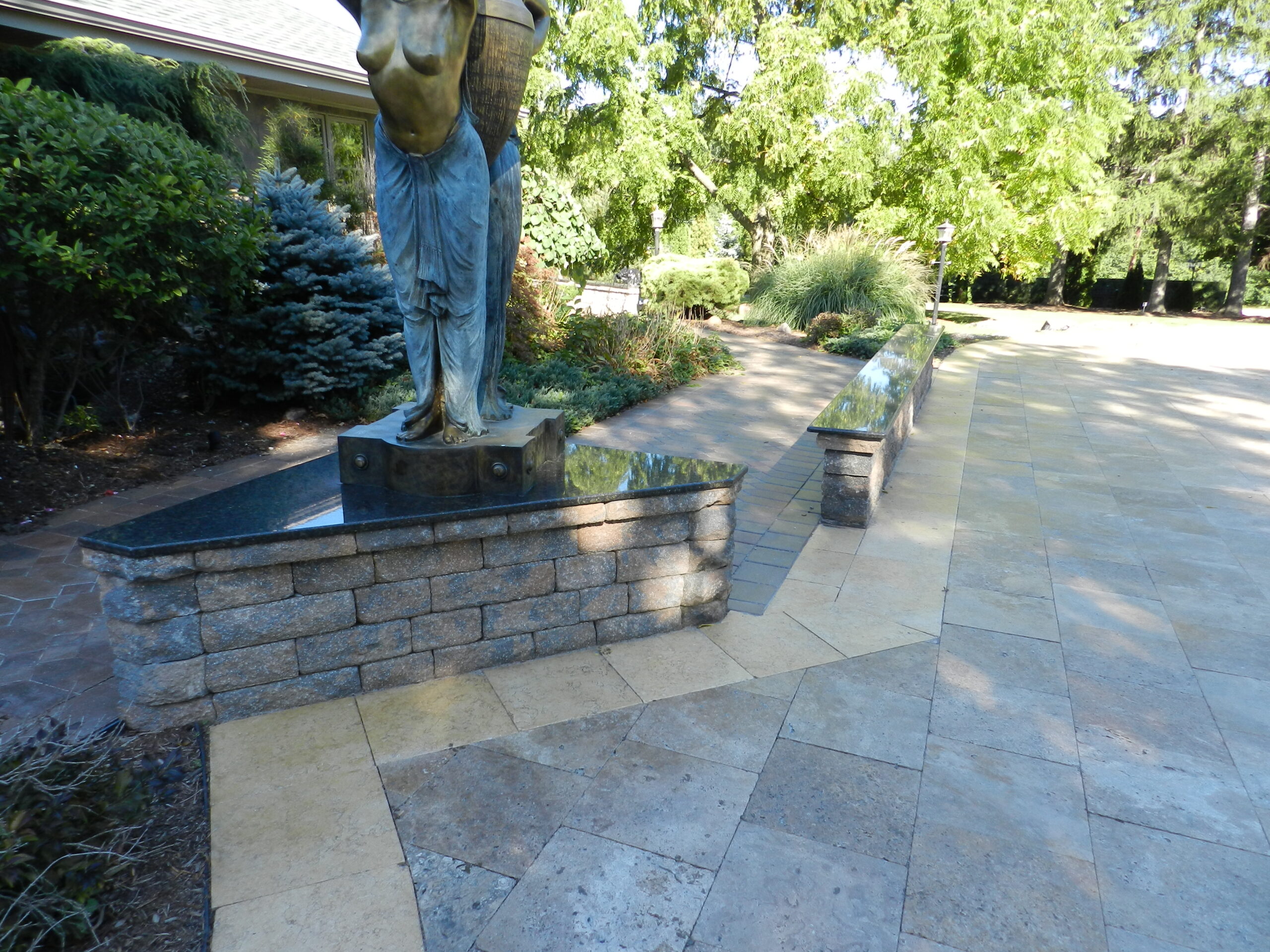hard surface around art features on patio | GMD Surfaces in Chicagoland and Northwest Indiana