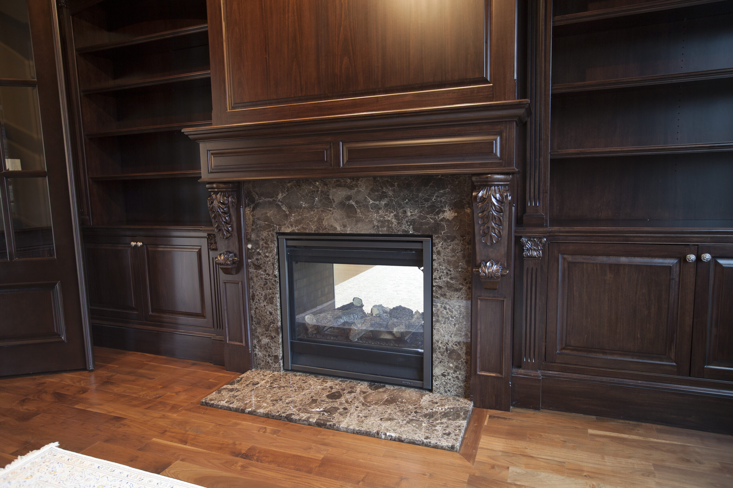 dark, fireplace with shelving | GMD Surfaces in Chicagoland and Northwest Indiana